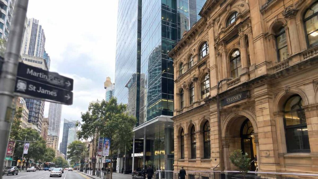 Sandstone heritage building next to a modern glass office tower in the Sydney CBD
