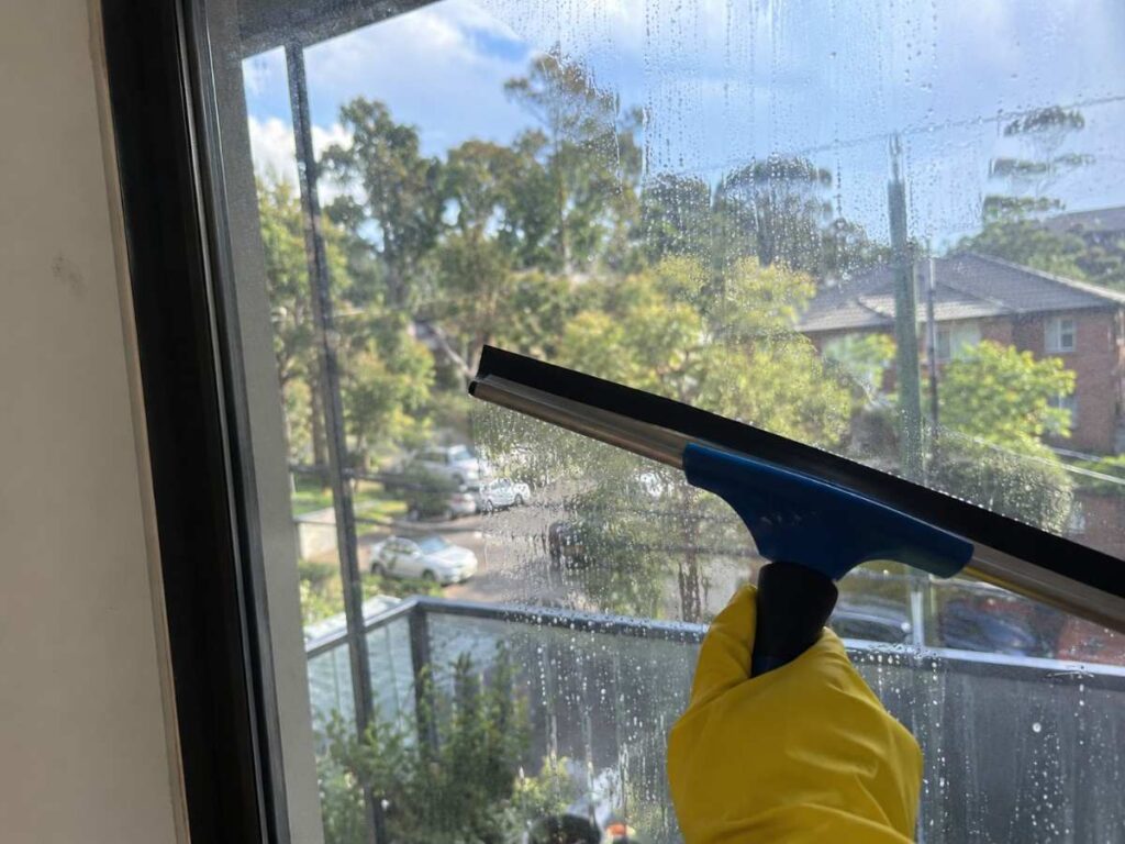 window cleaning using a squeegee for a streak free finish