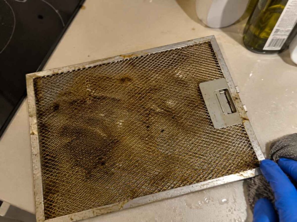 Greasy rangehood filter found in a new rental kitchen before unpacking