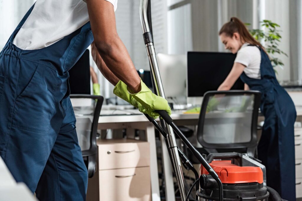 A cleaner moving a vacuum through a freshly built or renovated space