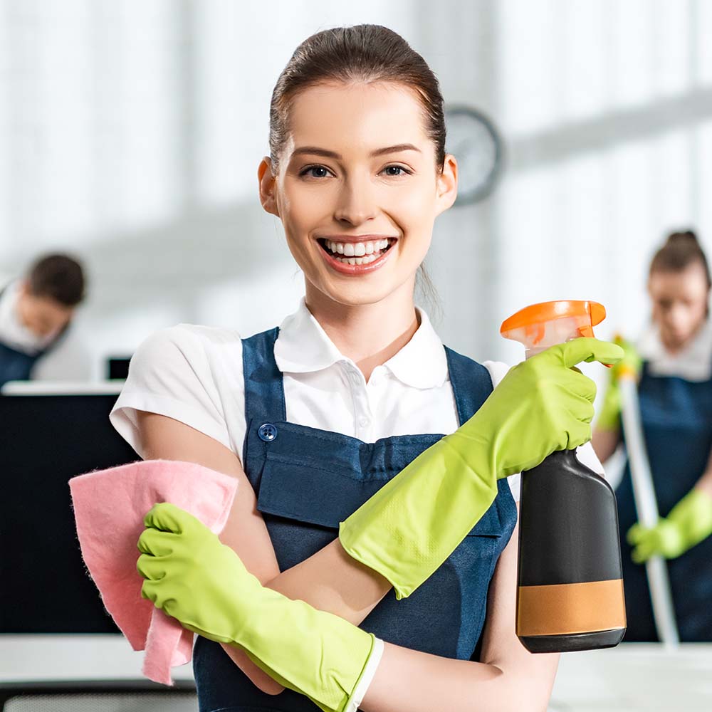 Top Sydney Cleaners team member spray-cleaning a kitchen surface